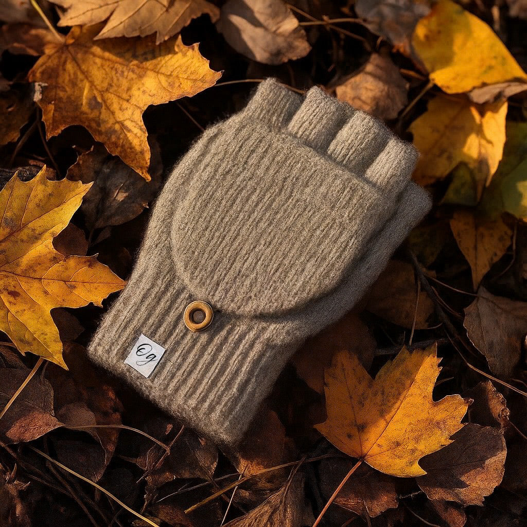 Grey mittens over maple leafs